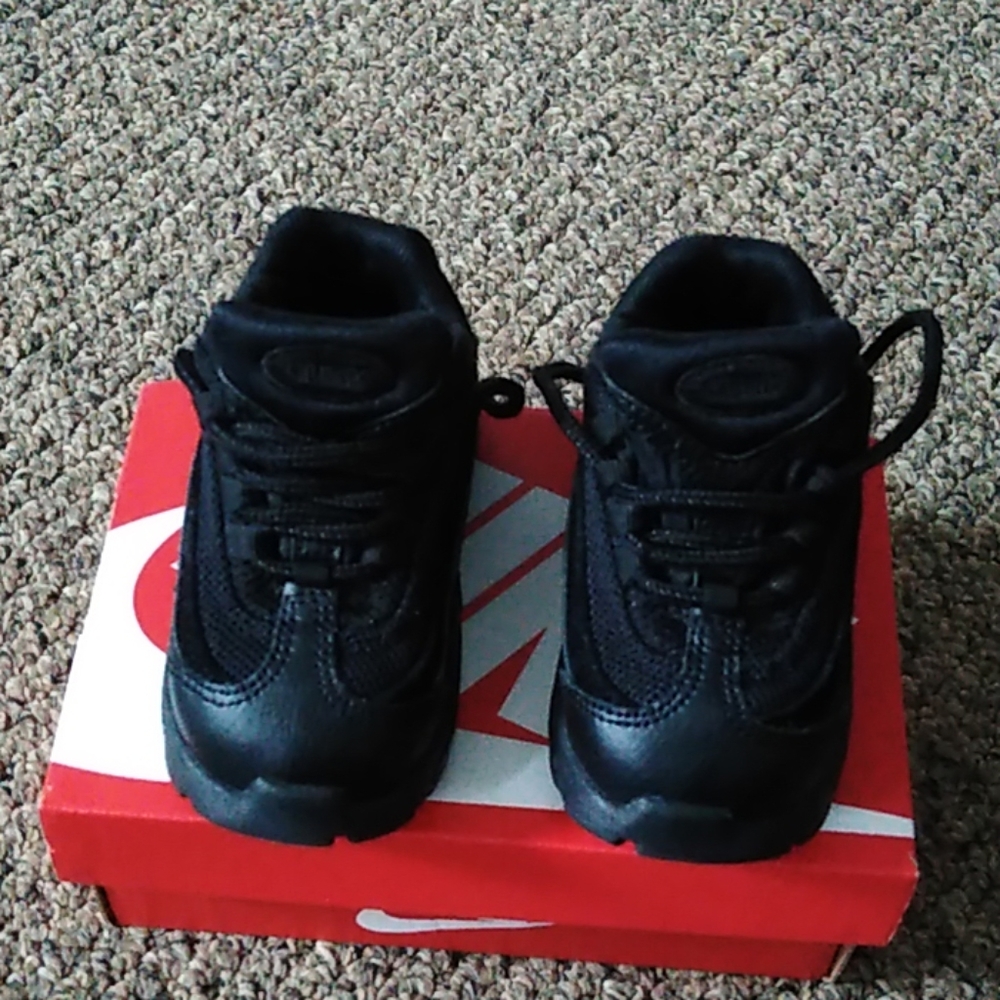 All black pair of 4c nike little max